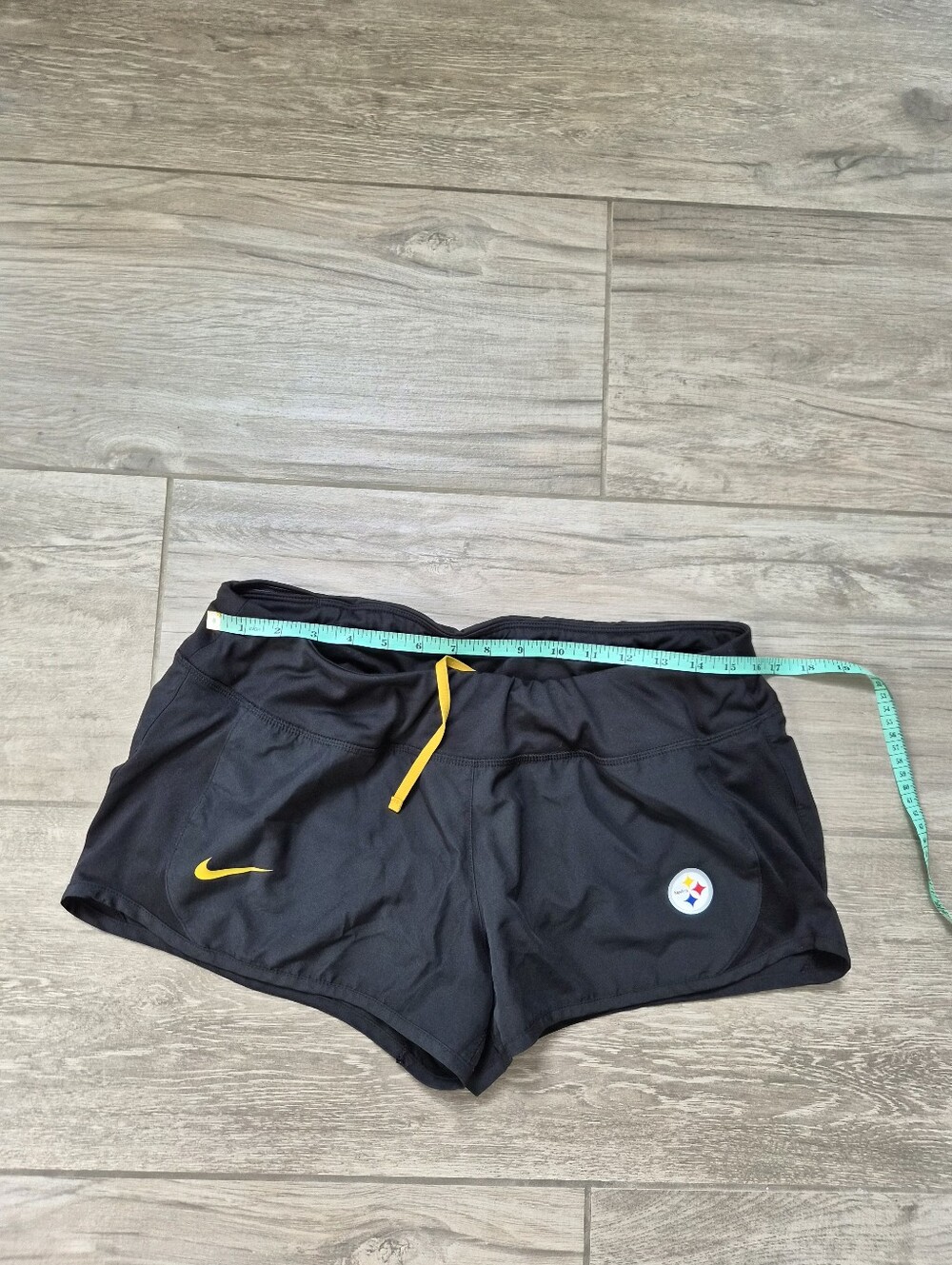 Nike Black Athletic Shorts with Yellow Accents and Steelers Patch